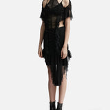 Black ruched dress with cold shoulder detail, sheer mesh panels, and asymmetric tulle hem worn with ankle boots — Ester Manas | Endless UAE