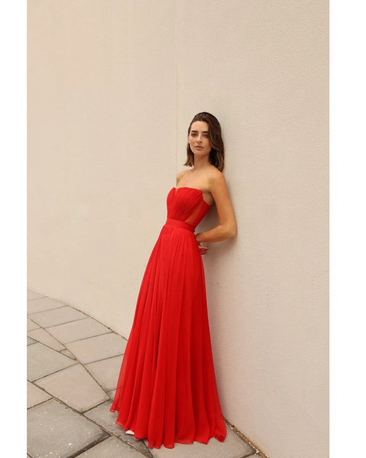 Red strapless evening gown with pleated bodice and flowing skirt — Bots© | Endless UAE