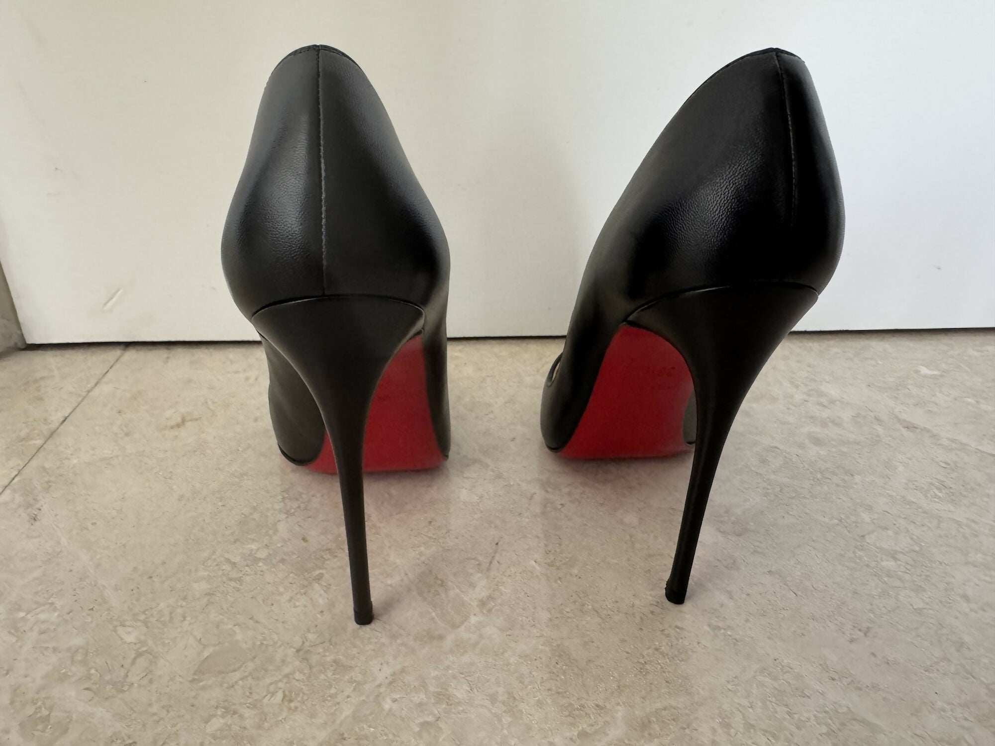 Black pointed-toe pumps with beige leather insole and white tissue paper insert — Endless | Endless UAE