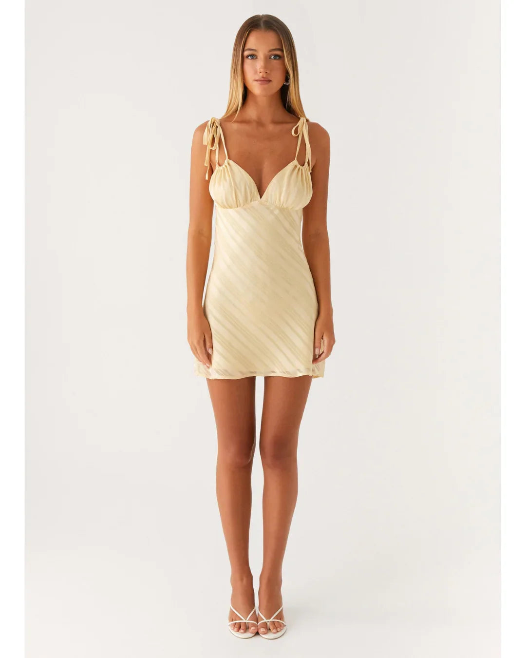 Cream tie-shoulder mini dress with wrap front and diagonal pleats — Peppermayo | Endless UAE