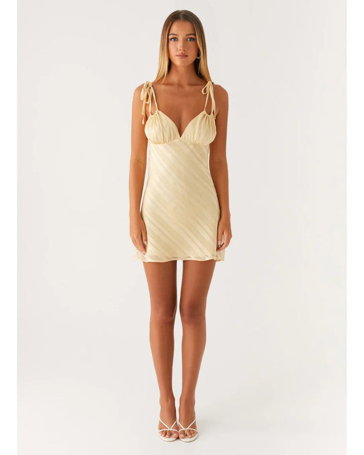 Cream tie-shoulder mini dress with wrap front and diagonal pleats — Peppermayo | Endless UAE
