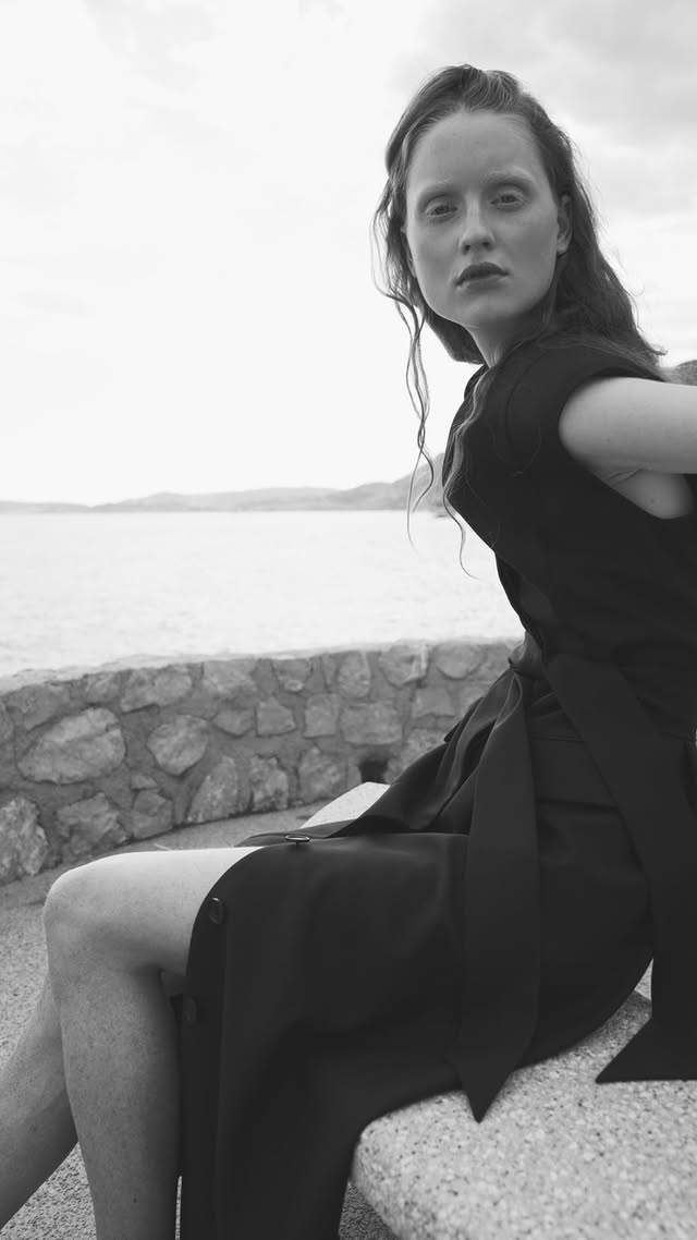 Woman wearing black sleeveless belted maxi dress by the seaside — LA Collection | Endless UAE