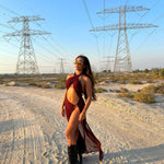Brown La Musique Halter Neck Sheer Dress worn by woman posing in desert with power lines — Scorpio Rizing | Endless UAE