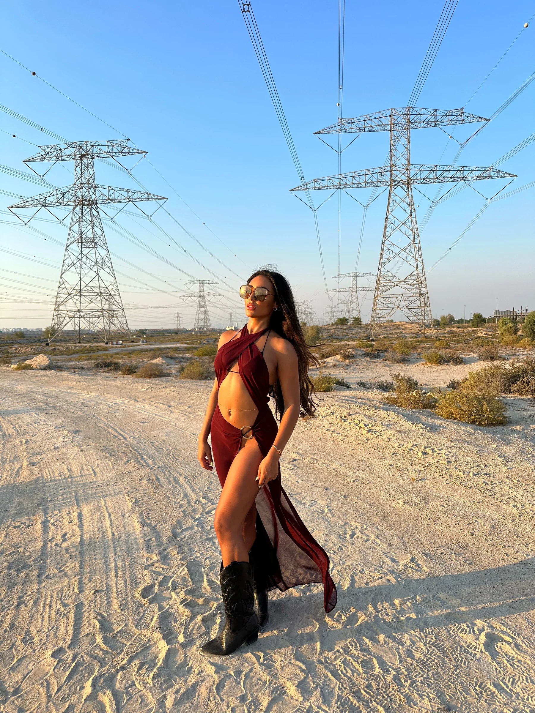 Brown La Musique Halter Neck Sheer Dress worn by woman posing in desert with power lines — Scorpio Rizing | Endless UAE