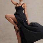 Elegant black strappy maxi dress with dramatic high-low volume skirt and pearl necklace styling — Club L London | Endless UAE