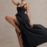 Elegant black strappy maxi dress with dramatic high-low volume skirt and pearl necklace styling — Club L London | Endless UAE