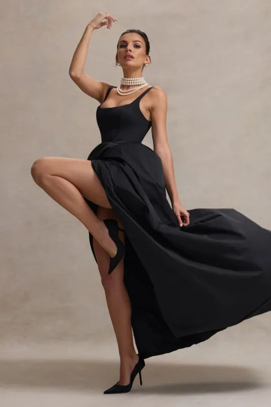 Elegant black strappy maxi dress with dramatic high-low volume skirt and pearl necklace styling — Club L London | Endless UAE