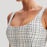 Woman wearing white tweed mini dress with grid pattern and scoop neckline — Meshki | Endless UAE