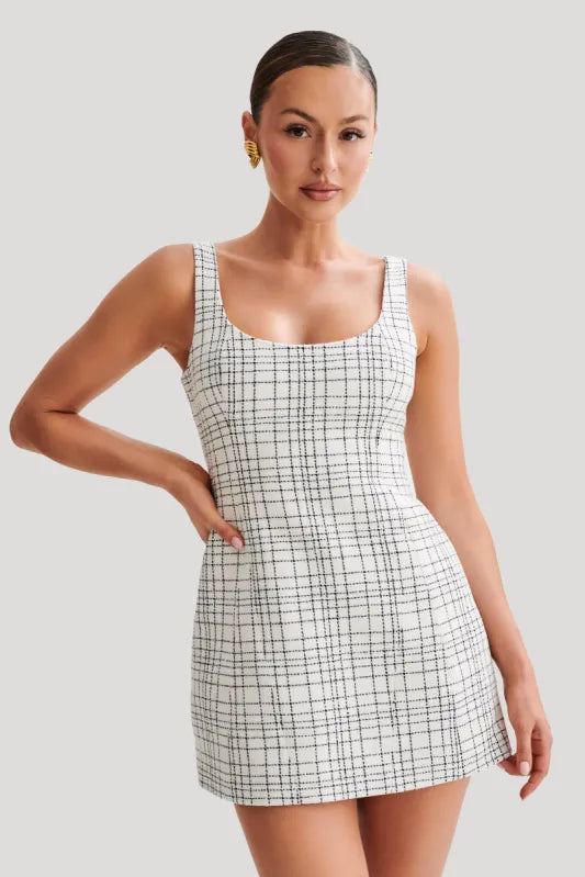 Woman wearing white tweed mini dress with grid pattern and scoop neckline — Meshki | Endless UAE