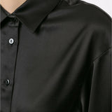 Black cropped silk shirt with wrap-around tie detail and collar, worn by model — Christopher Esber | Endless UAE