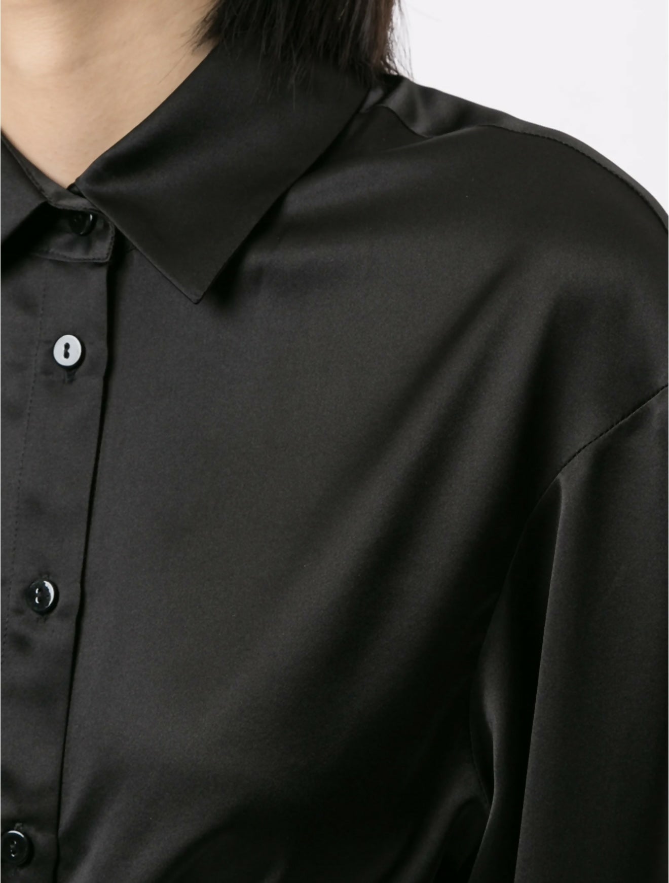 Black cropped silk shirt with wrap-around tie detail and collar, worn by model — Christopher Esber | Endless UAE
