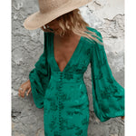 Emerald green floral jacquard mini dress with puff sleeves and V-neckline styled with straw hat — Rat & Boa | Endless UAE