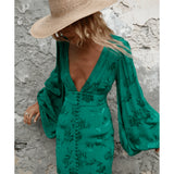 Emerald green floral jacquard mini dress with puff sleeves and V-neckline styled with straw hat — Rat & Boa | Endless UAE