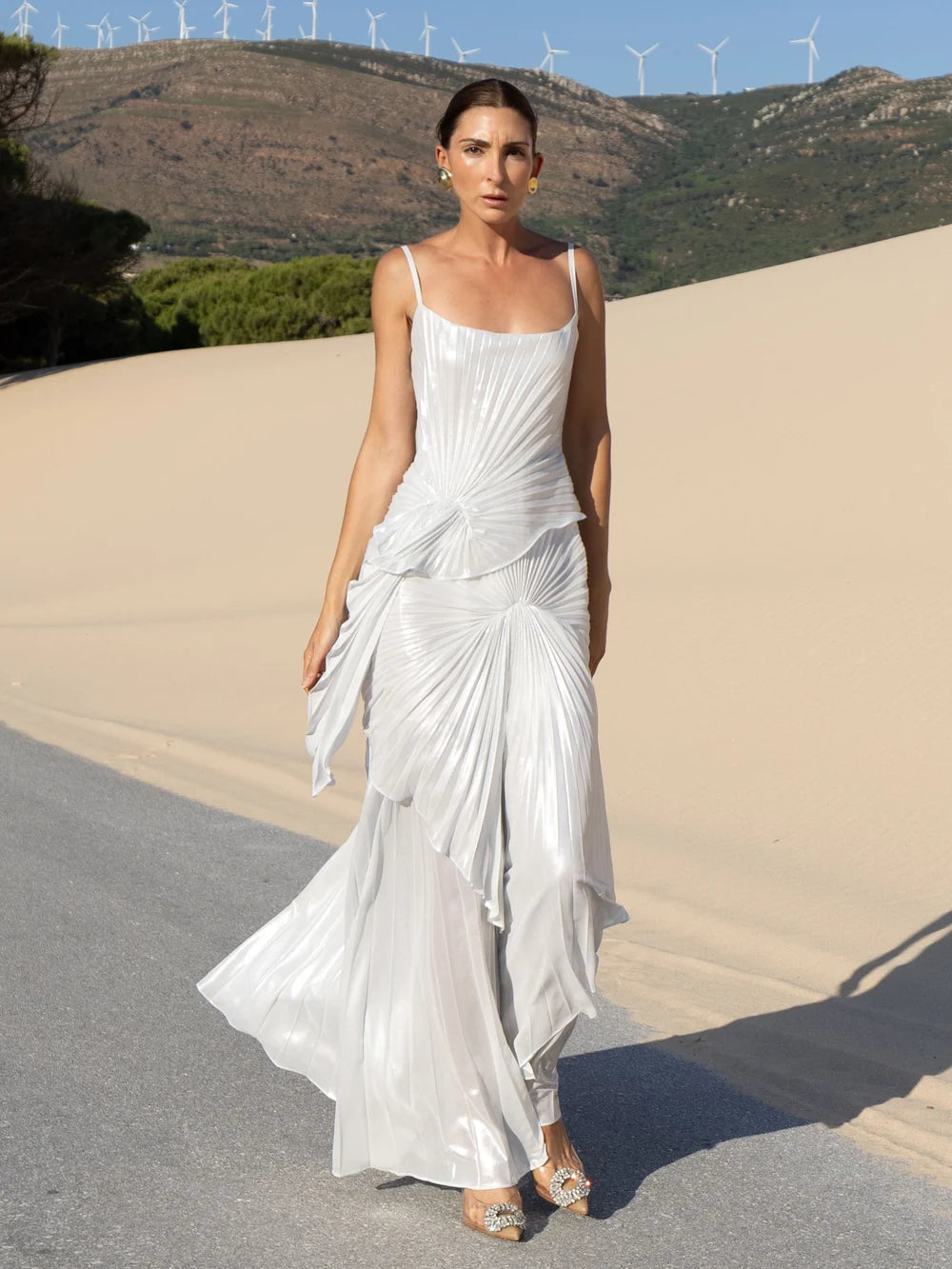 Woman wearing white draped Torrent Dress in modern architectural setting — Georgia Hardinge | Endless UAE