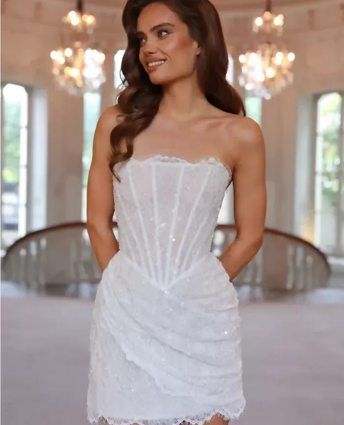 Elegant white strapless mini dress with sequin embellishments and corset bodice detail — Rosie Etienne | Endless UAE