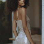 Woman wearing champagne sequin mini dress with spaghetti straps — Endless | Endless UAE