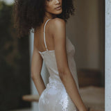 Woman wearing champagne sequin mini dress with spaghetti straps — Endless | Endless UAE