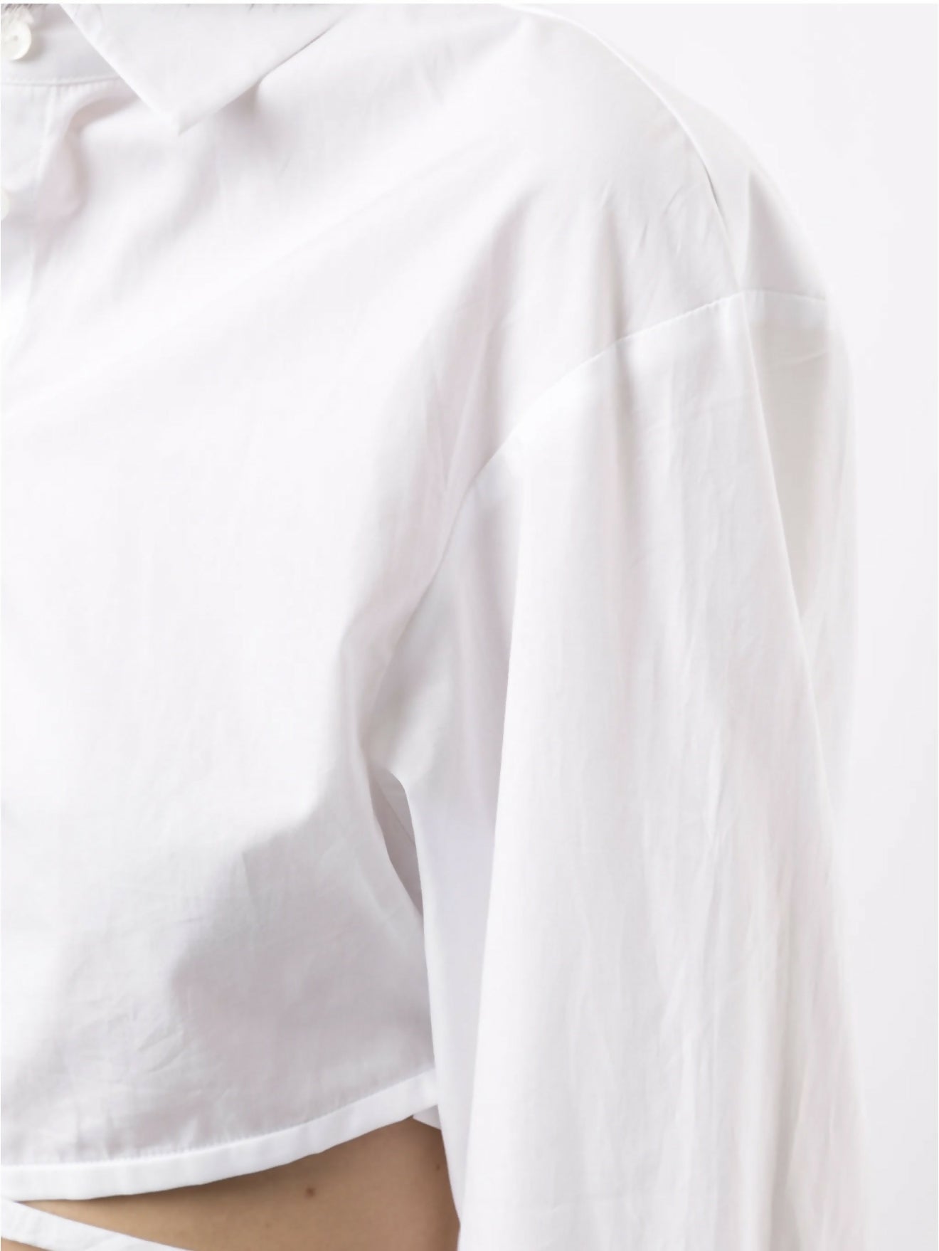 Cropped white silk shirt with wrap-around tie detail and chest pocket — Christopher Esber | Endless UAE