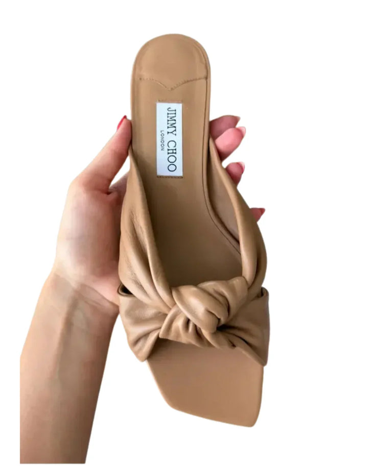 Beige leather flat sandal with twisted knot detail and black sole — Jimmy Choo | Endless UAE