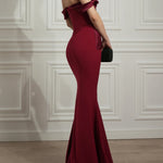 Elegant ruby red off-shoulder mermaid gown with bow detail and train — Rhea Costa | Endless UAE