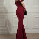 Elegant ruby red off-shoulder mermaid gown with bow detail and train — Rhea Costa | Endless UAE