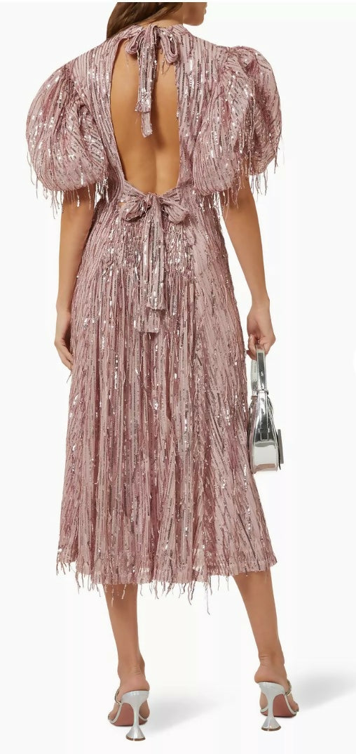 Woman wearing a dusty pink sequin fringe midi dress with puffed sleeves — Endless | Endless UAE