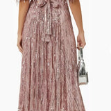Woman wearing a dusty pink sequin fringe midi dress with puffed sleeves — Endless | Endless UAE