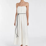 Model wearing Shaniya Cream Marle strapless midi dress with black tie belt and sandals — Dissh | Endless UAE