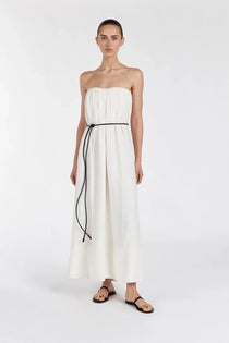 Model wearing Shaniya Cream Marle strapless midi dress with black tie belt and sandals — Dissh | Endless UAE