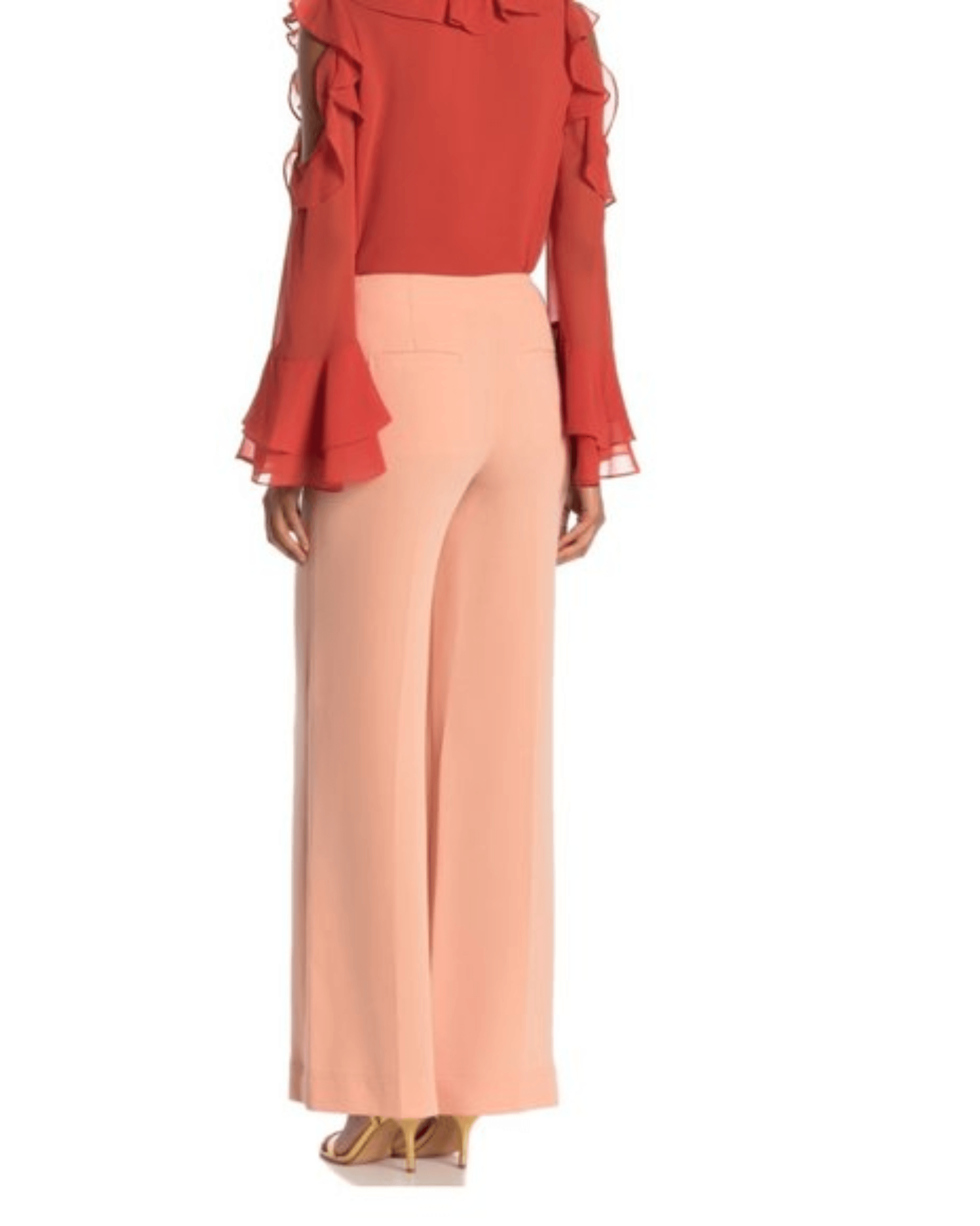 Peach wide-leg pants with high waist and flowing silhouette, styled with coral ruffled blouse — Diane Von Furstenberg | Endless UAE