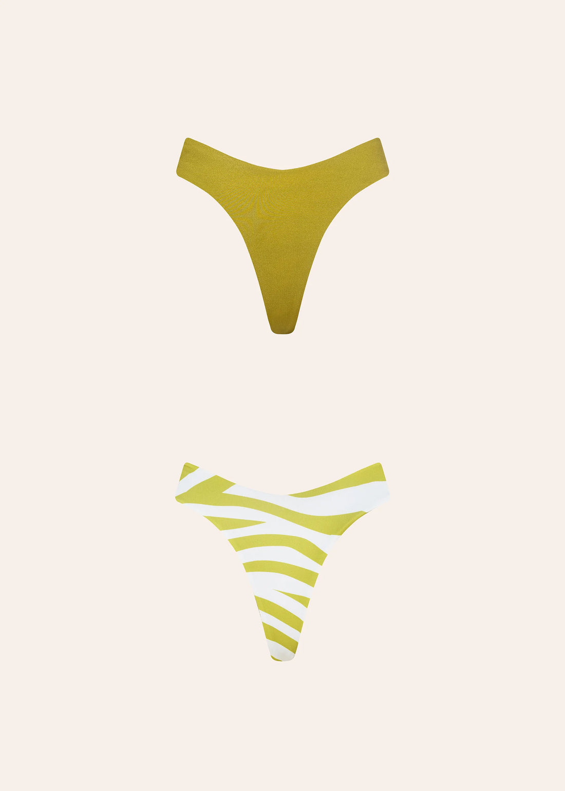 Reversible green bikini bottom with striped pattern on one side and solid color on the other — Dvete | Endless UAE