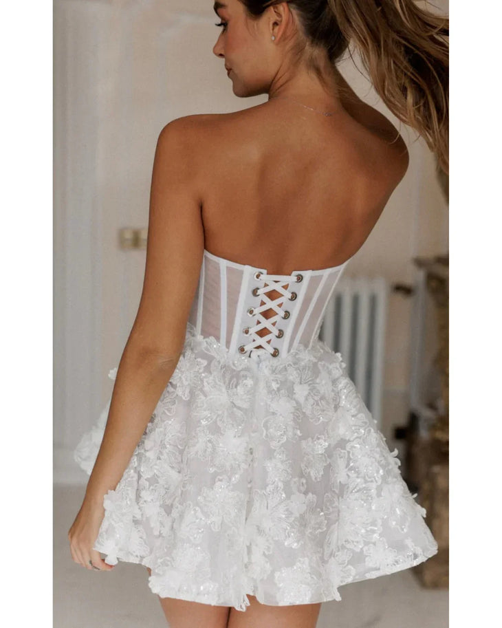 White strapless lace dress with textured floral details and fitted bodice — Rosie Etienne | Endless UAE
