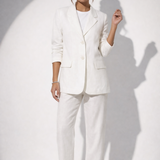 Woman wearing white linen blazer and trousers with white sandals — & Other Stories | Endless UAE