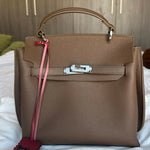 Brown leather structured handbag with gold hardware and pink shoulder strap — Endless | Endless UAE