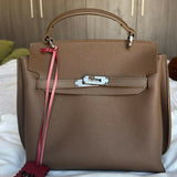 Brown leather structured handbag with gold hardware and pink shoulder strap — Endless | Endless UAE