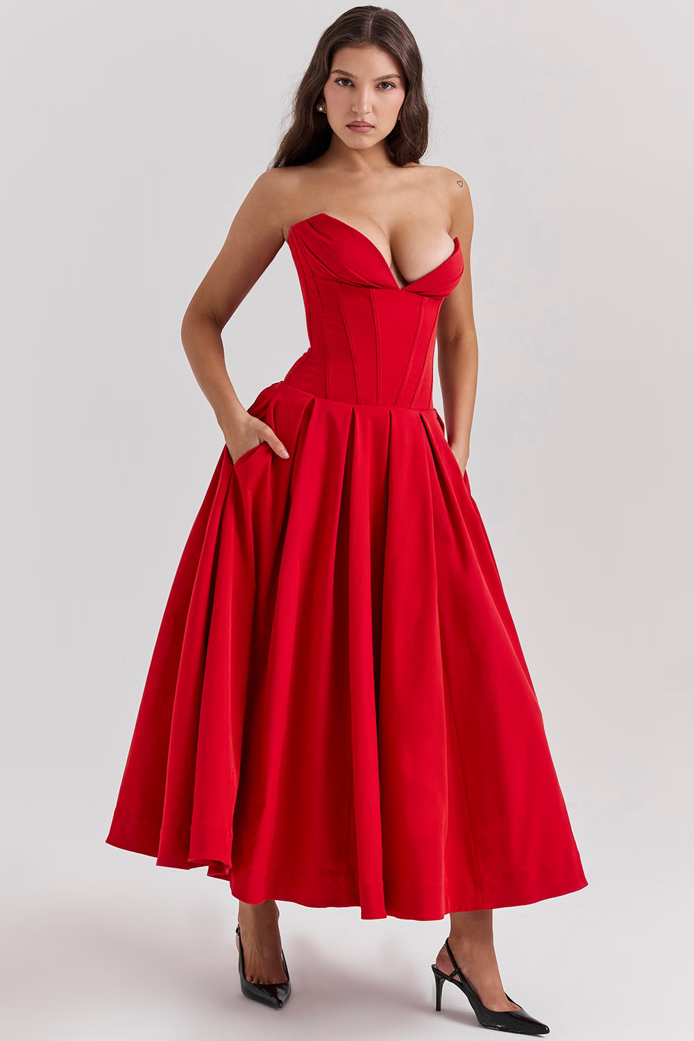 Woman wearing a red strapless corset midi dress with full skirt — House of CB | Endless UAE