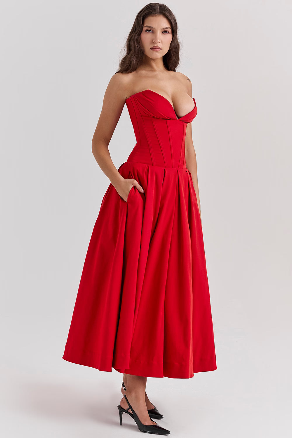 Woman wearing a red strapless corset midi dress with full skirt — House of CB | Endless UAE