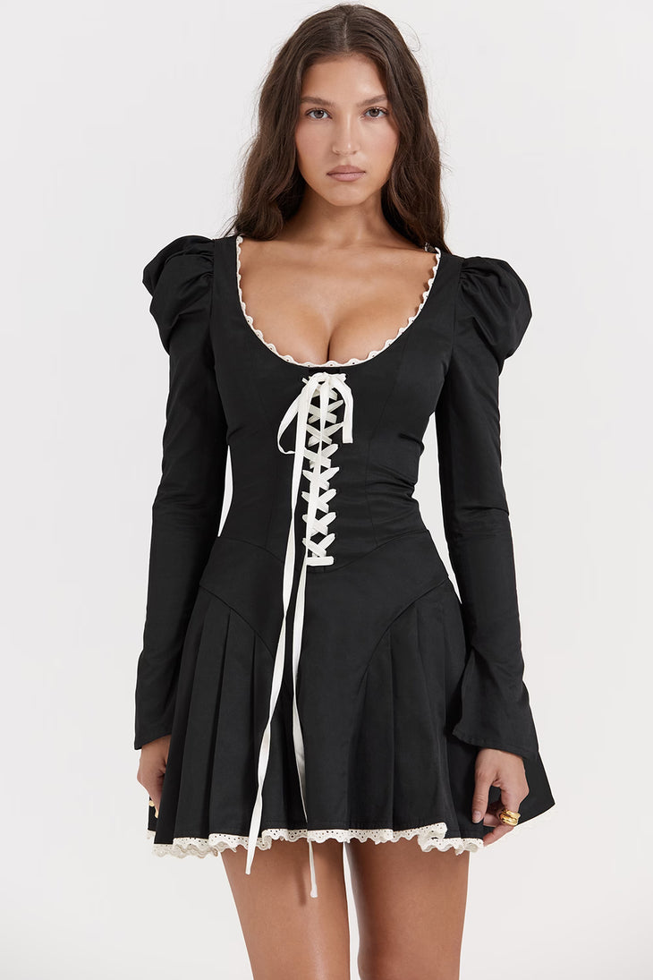 Black mini dress with white lace-up corset detail, puff sleeves, and pleated skirt — House of CB | Endless UAE