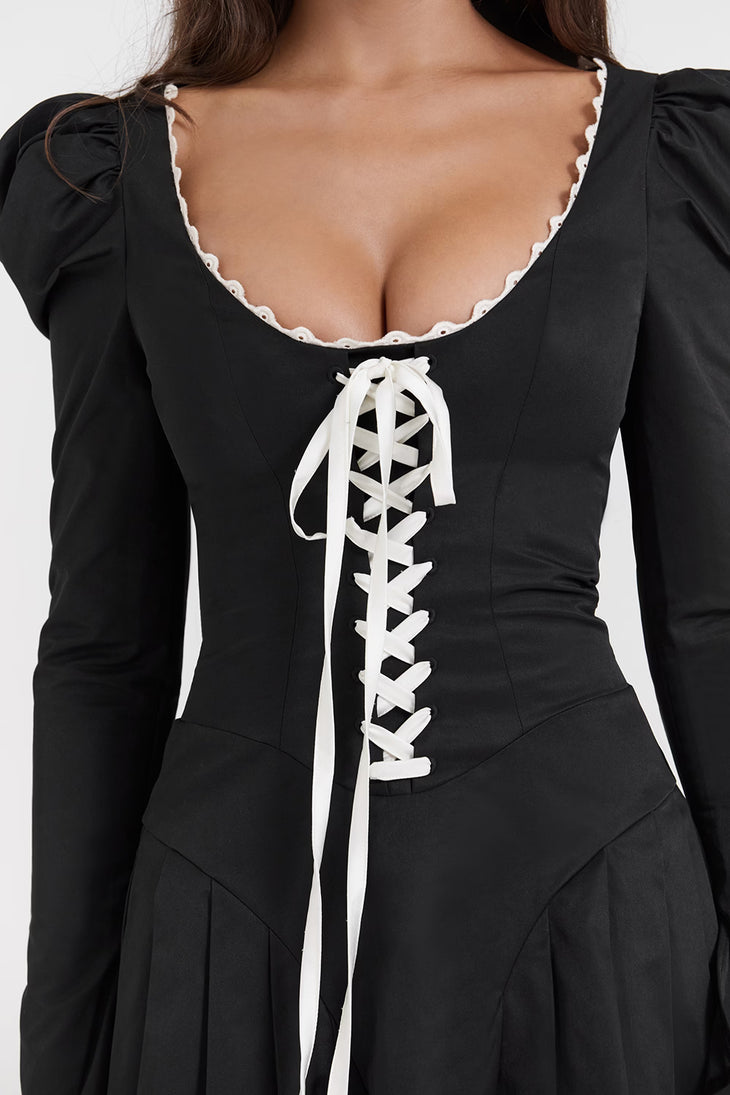 Black fitted mini dress with white corset lacing, puff sleeves, and pleated skirt detail — House of CB | Endless UAE