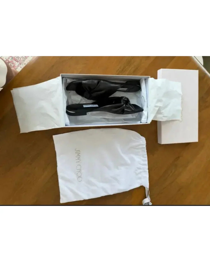 Black leather flat sandals with bow detail — Jimmy Choo | Endless UAE