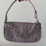 Mini Rachel Lilac Croco Embossed Leather Bag held in hand against white background — By Far | Endless UAE