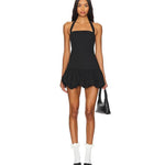 Black halter neck mini dress with bubble hem detail, worn with white socks and black pointed shoes — Lioness | Endless UAE