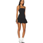 Black halter neck mini dress with ruffled hem worn with white socks and black heels — Lioness | Endless UAE