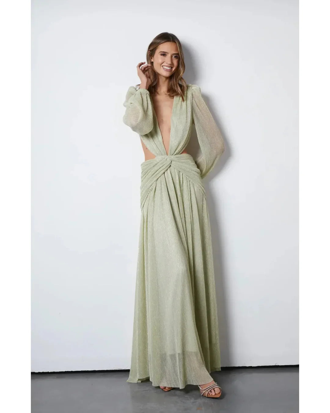 Woman wearing The Goddess Green Dress by Anne Louise Boutique — Endless UAE