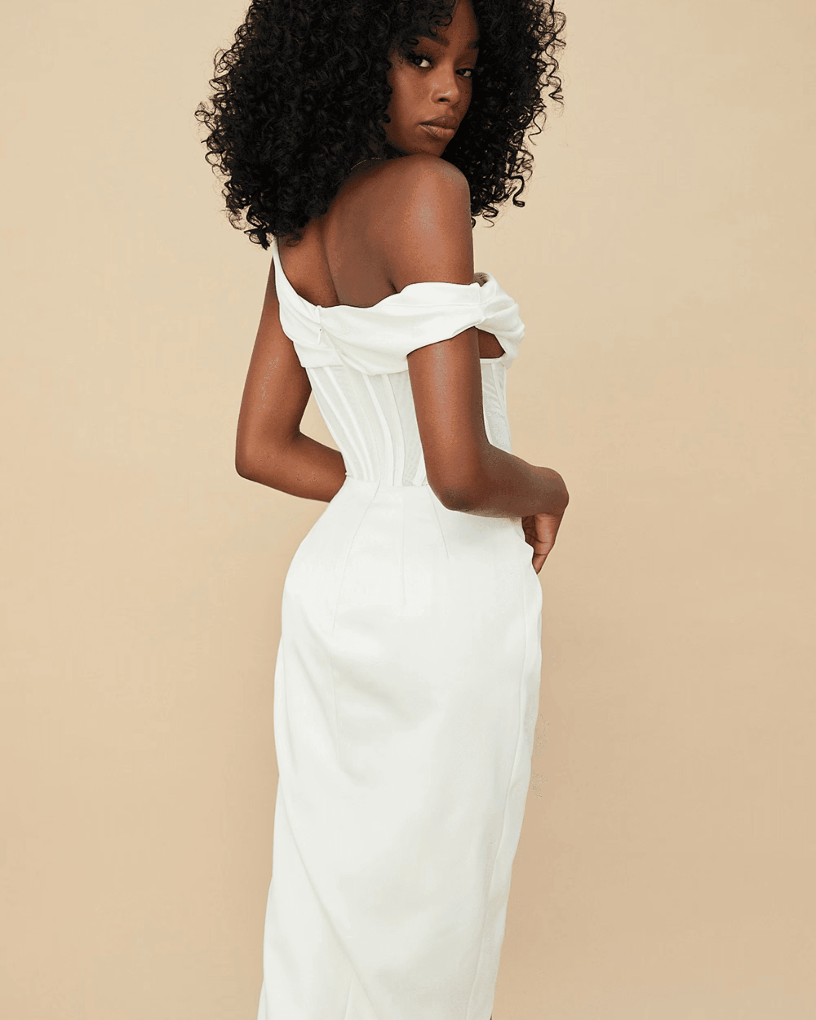Elegant cream off-shoulder corset midi dress with structured bodice and flowing skirt, shown from back view — House of CB | Endless UAE
