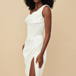 Elegant white asymmetric corset midi dress with sheer mesh panel, draped bodice and high slit modeled on beige background — House of CB | Endless UAE