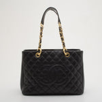 Black quilted caviar leather Grand Shopper Tote with gold chain straps and CC logo — Chanel | Endless UAE