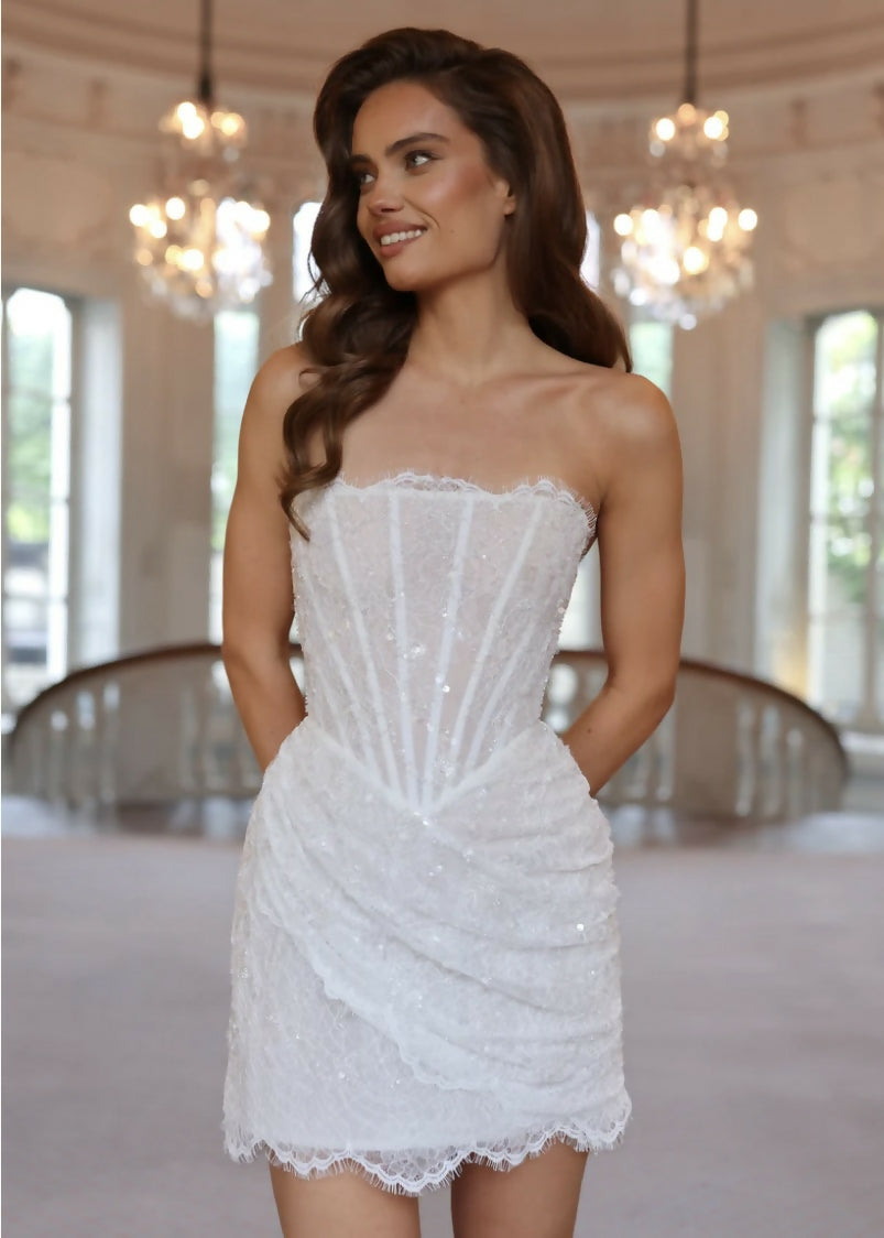 Elegant white strapless mini dress with sequin embellishments and lace trim detailing — Rosie Etienne | Endless UAE