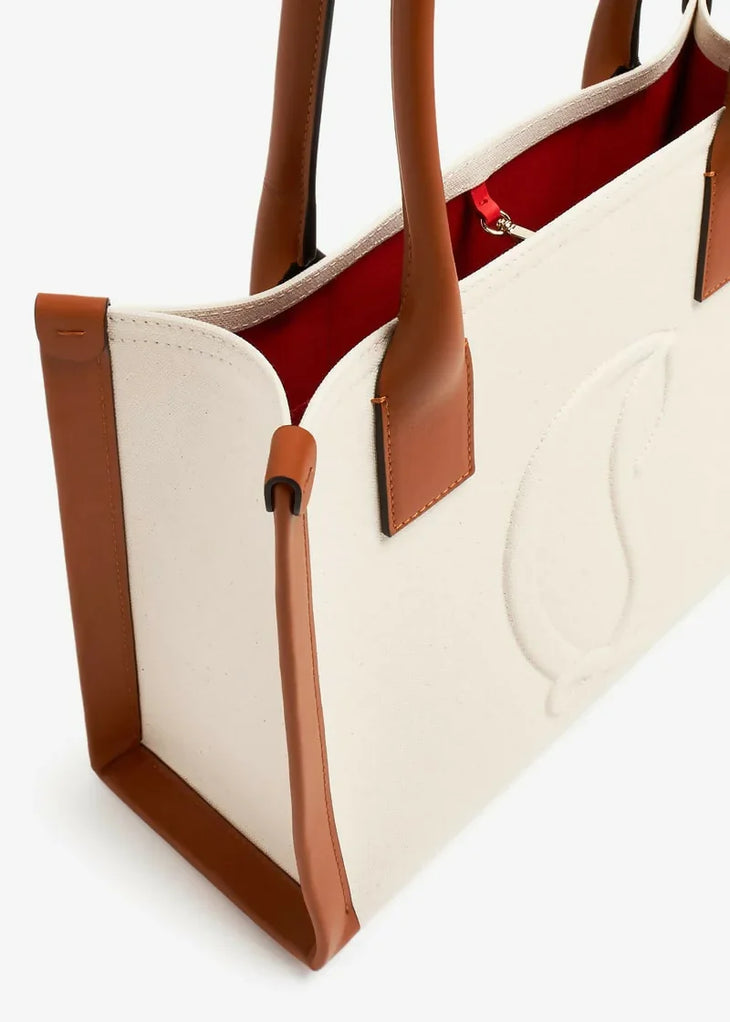 Cream and tan leather tote bag with red interior lining and toggle closure detail — Christian Louboutin | Endless UAE