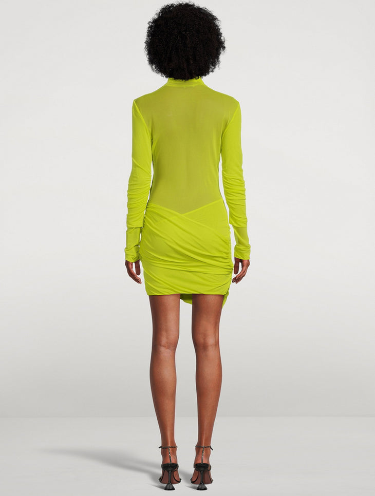 Rear view of lime green long-sleeved mini dress with ruched draping detail and mock neck — Gauge 81 | Endless UAE